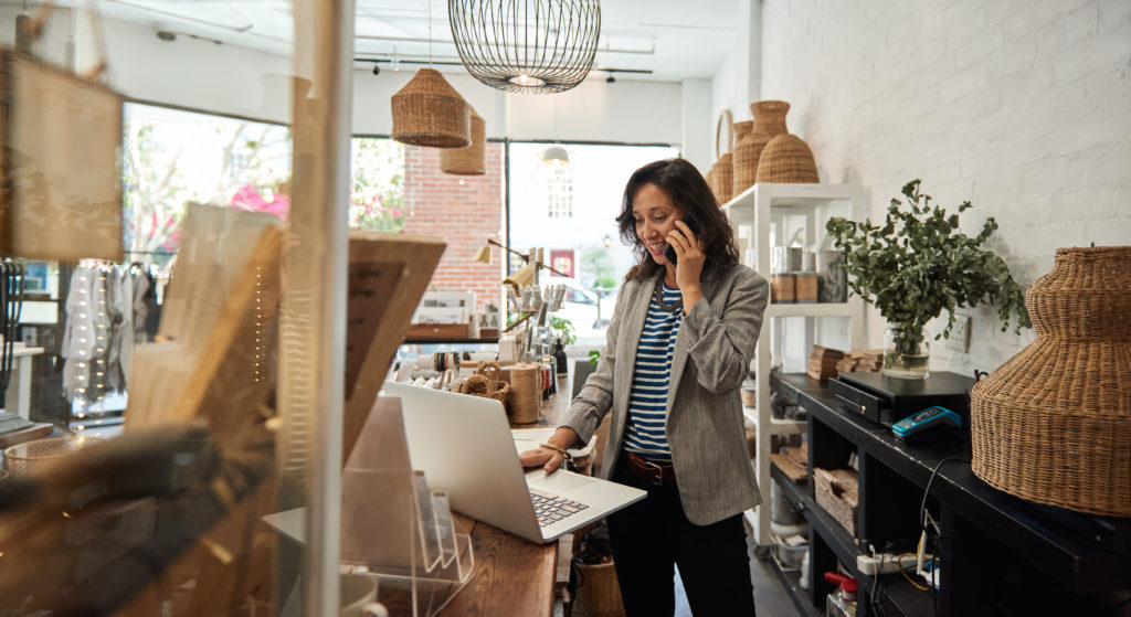 Lady working in small business store – demonstrating ecommerce integration